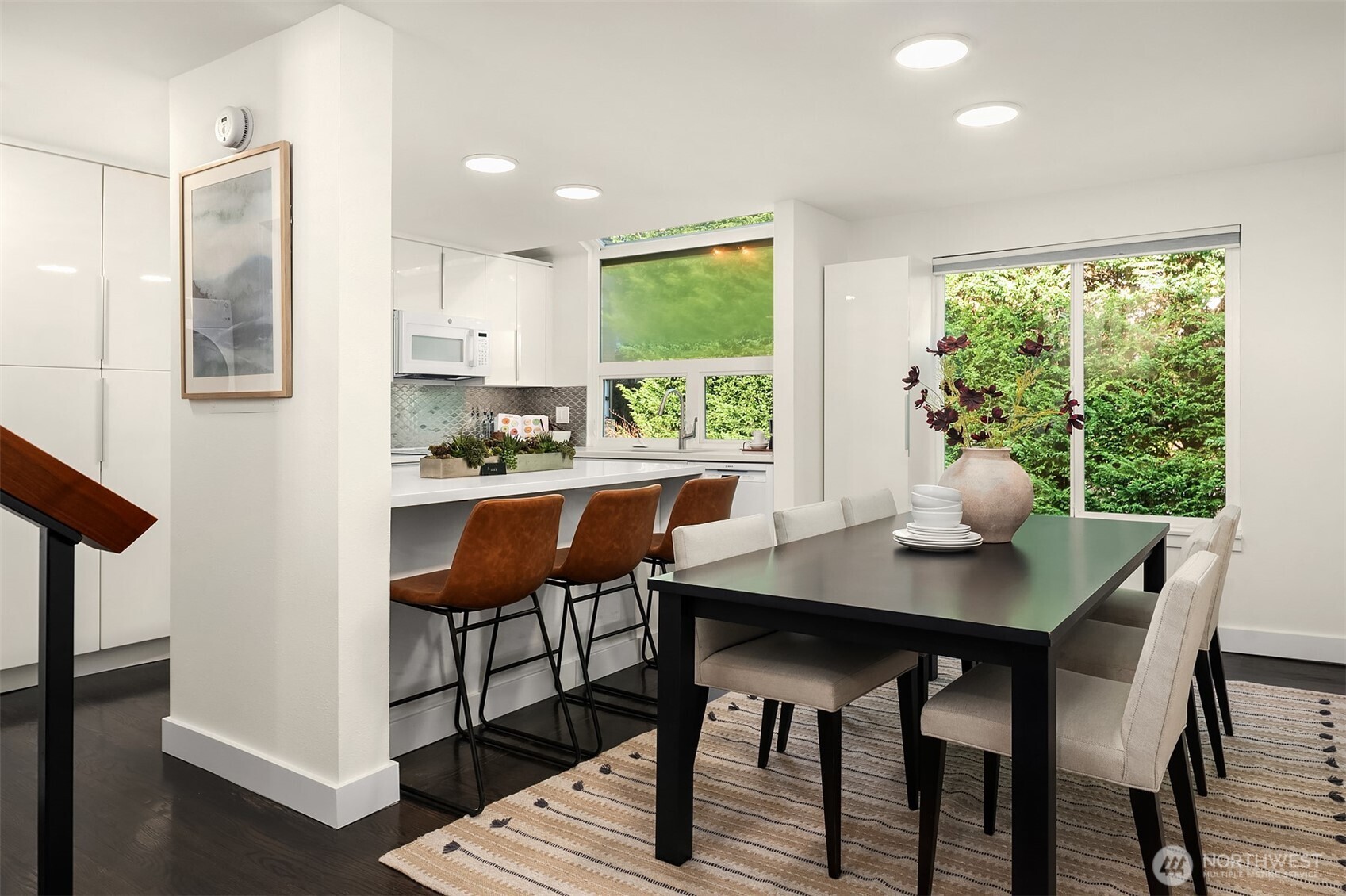202 West Olympic Place, Unit 405 Seattle, WA 98119 - Photo 5 of 26 a view of a dining room with furniture window and outside view