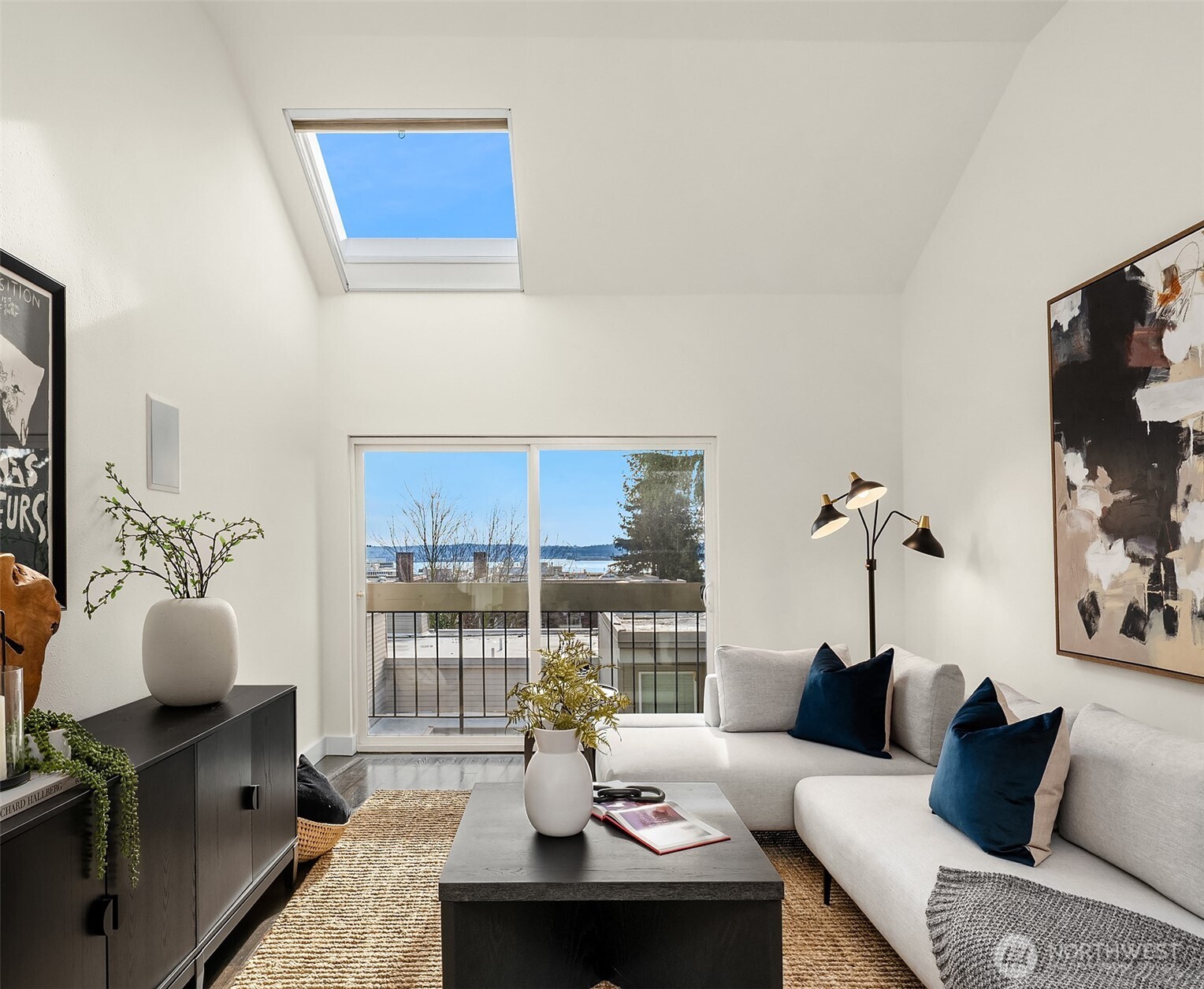 202 West Olympic Place, Unit 405 Seattle, WA 98119 - Photo 6 of 26 a living room with furniture and a floor to ceiling window