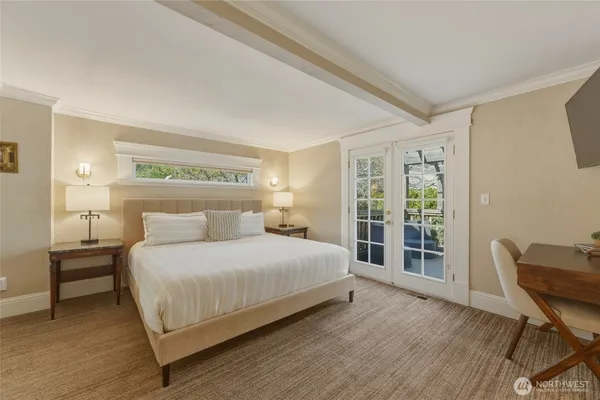 a bedroom with a bed and a chair