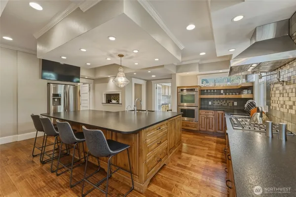 a large kitchen with lots of counter space and windows