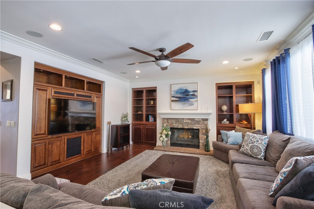 28483 Nautical Point Circle Menifee, CA 92585 - Photo 9 of 44 a living room with furniture and a fireplace