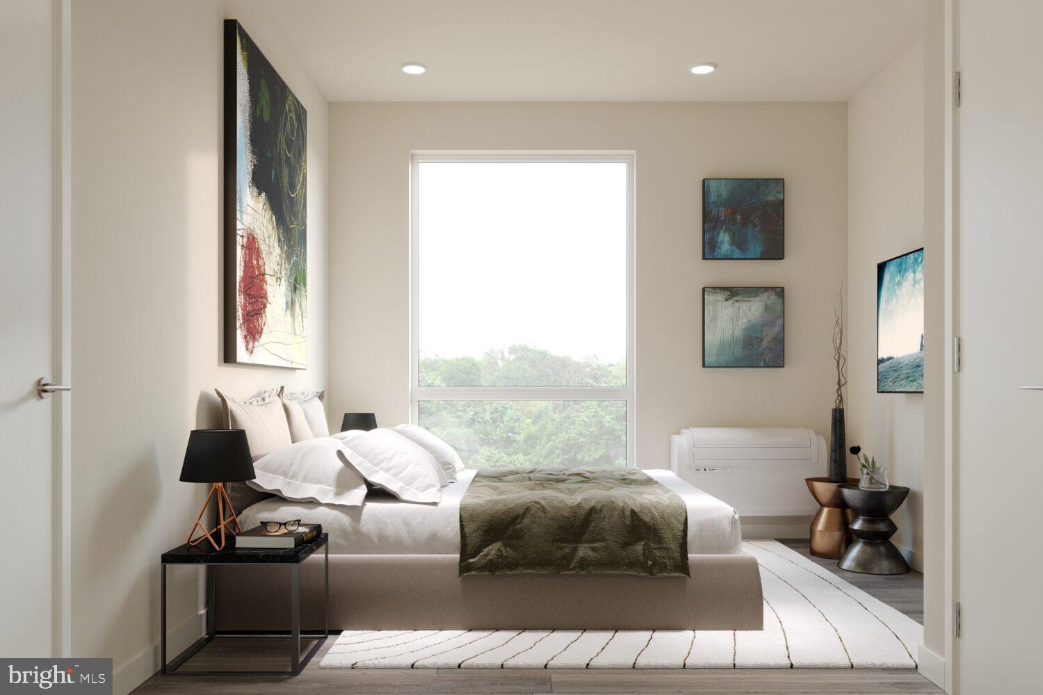 1314 Spring Garden Street, Unit 328 Philadelphia, PA 19123 - Photo 5 of 26 a bedroom with furniture and a large window