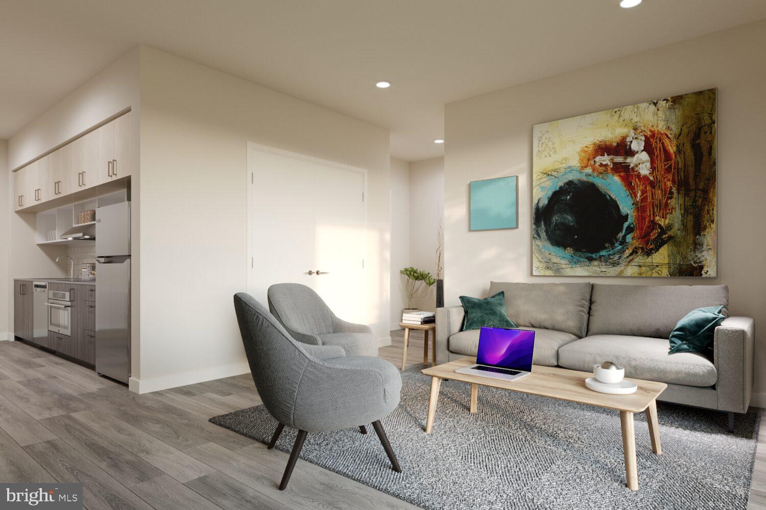 1314 Spring Garden Street, Unit 328 Philadelphia, PA 19123 - Photo 6 of 26 a living room with furniture and a wooden floor