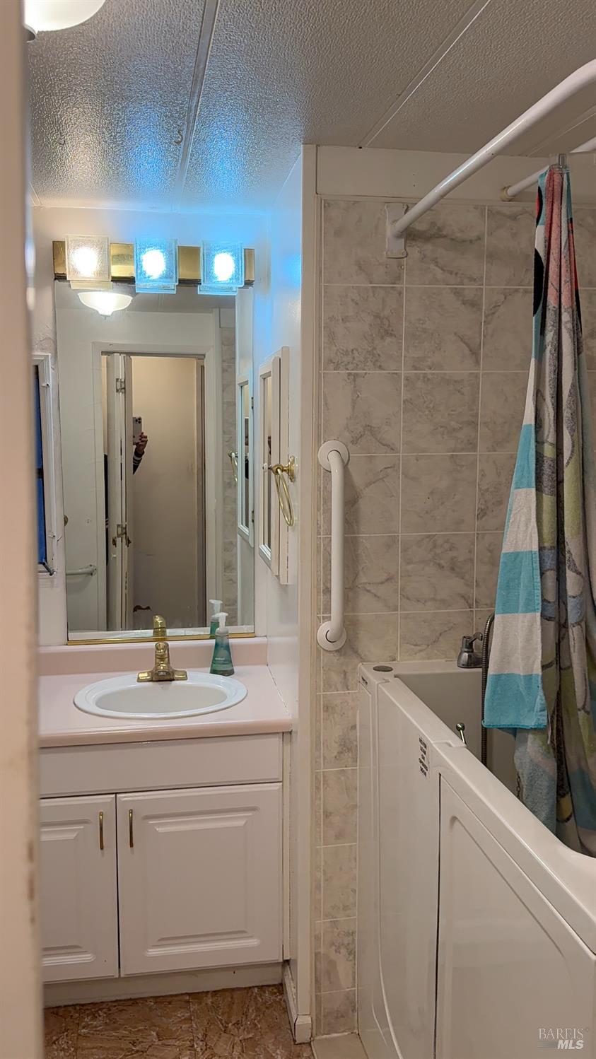 110 San Miguel Road Vallejo, CA 94590 - Photo 9 of 10 a bathroom with a sink and a mirror