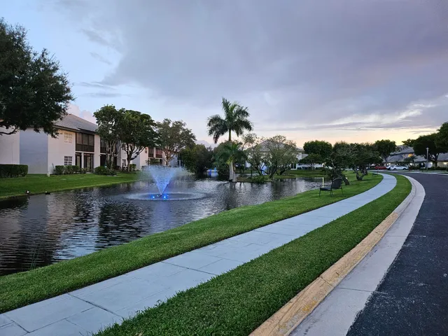 a view of a house with a fountain