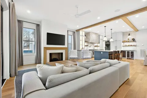 a living room with furniture fireplace and flat screen tv