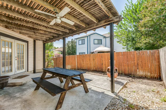 a view of a two chairs in the patio