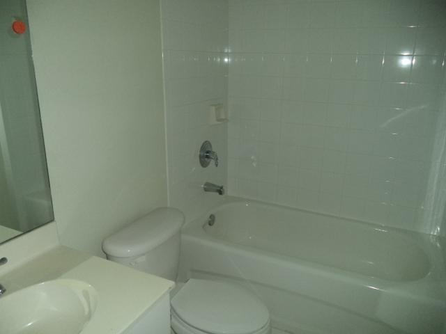3750 North Jog Road, Unit 203 West Palm Beach, FL 33411 - Photo 1 of 10 a bathroom with a toilet and a shower