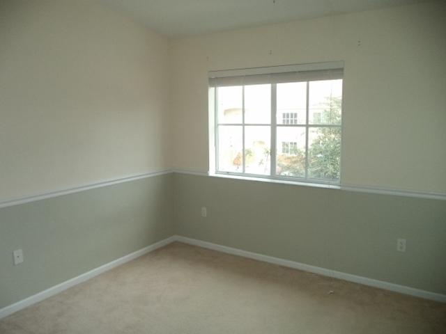 3750 North Jog Road, Unit 203 West Palm Beach, FL 33411 - Photo 2 of 10 an empty room with a window