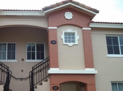 3750 North Jog Road, Unit 203 West Palm Beach, FL 33411 - Photo 3 of 10 a view of a house with a small window