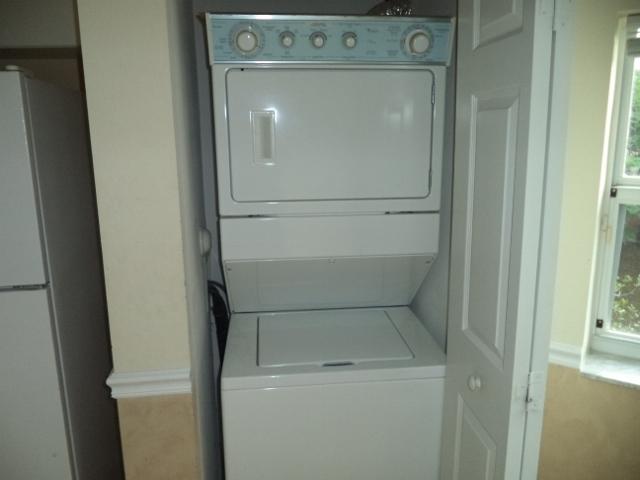 3750 North Jog Road, Unit 203 West Palm Beach, FL 33411 - Photo 6 of 10 a utility room with dryer and washer