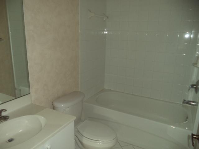 3750 North Jog Road, Unit 203 West Palm Beach, FL 33411 - Photo 8 of 10 a bathroom with a sink and toilet