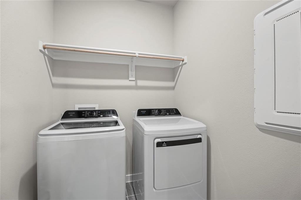 507 Avocet Road Princeton, TX 75407 - Photo 26 of 31 Integrated laundry area featuring shelving with a hanging rod