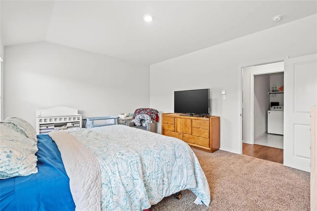 171 Seabiscuit Road Caddo Mills, TX 75135 - Photo 5 of 19 a bedroom with a bed and a flat screen tv