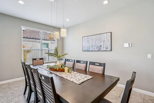 a bathroom with a sink a toilet a mirror and shower