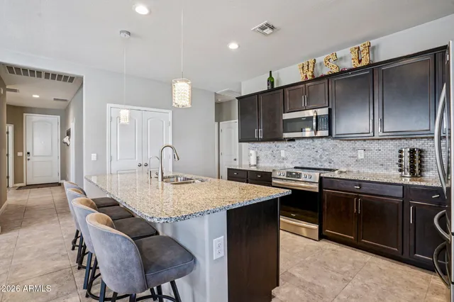 a bathroom with a shower and a sink