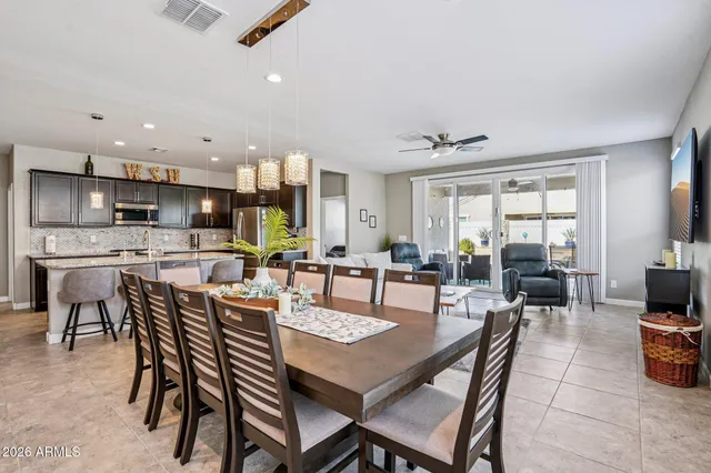 an aerial view of residential houses with yard
