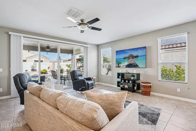 a kitchen with granite countertop stainless steel appliances a sink dishwasher a refrigerator a stove top oven and a center island