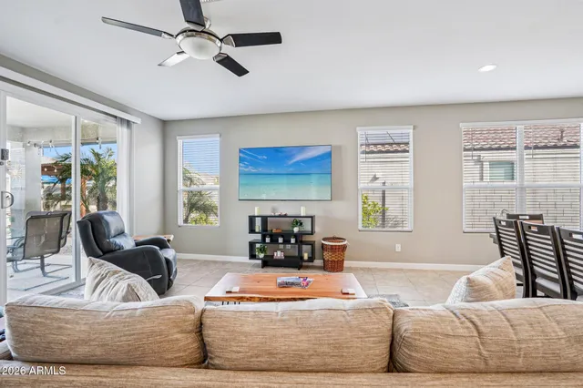 a kitchen with a sink a faucet a chandelier and living room view