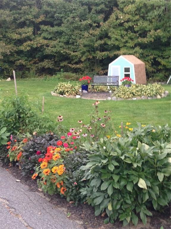345 West River Road Augusta, ME 04330 - Photo 31 of 33 Perennial gardens near garage