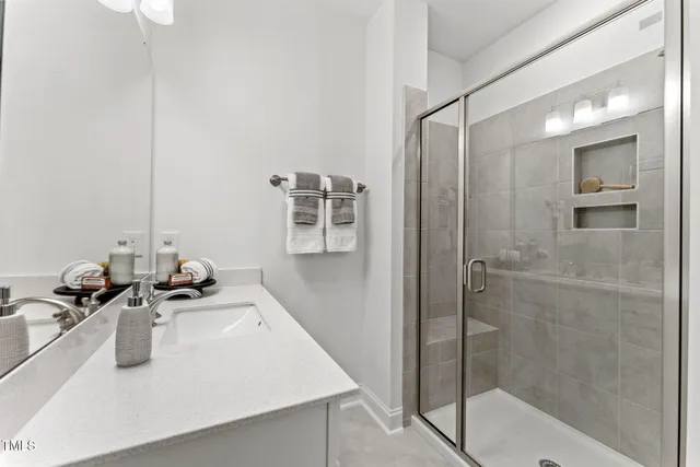 a bathroom with a double vanity sink mirror and double