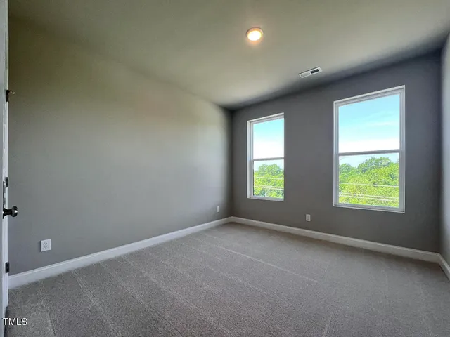 an empty room with closet area