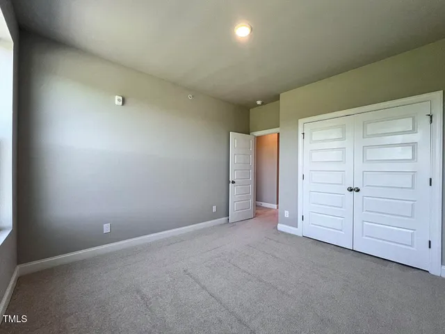 a bathroom with a double vanity sink toilet mirror and shower