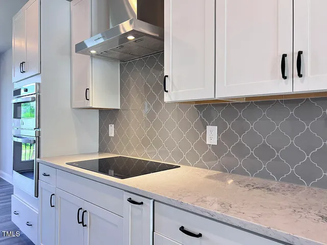 a kitchen with granite countertop a sink and a granite counter tops