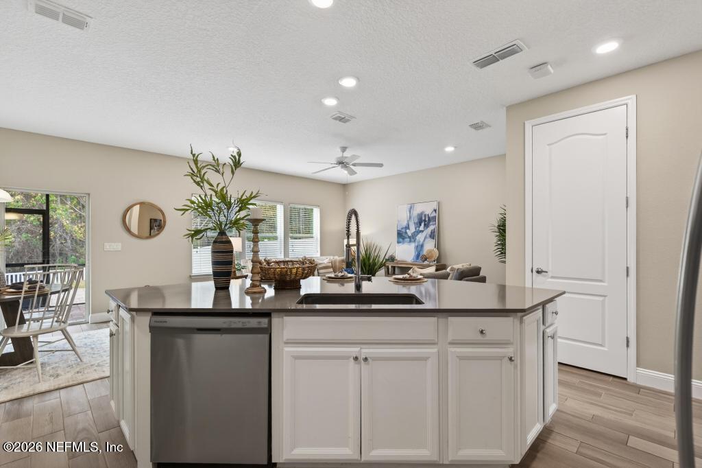 383 Sweet Oak Way St. Augustine, FL 32095 - Photo 14 of 74 a bathroom with a sink and a mirror