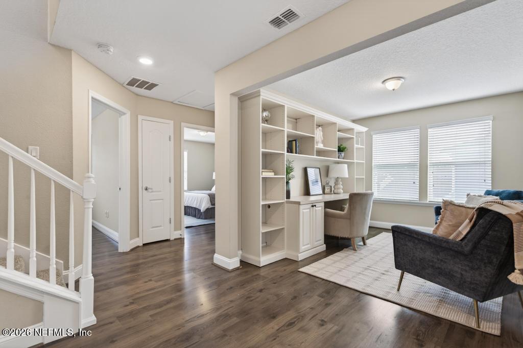 383 Sweet Oak Way St. Augustine, FL 32095 - Photo 30 of 74 a living room with furniture and a wooden floor