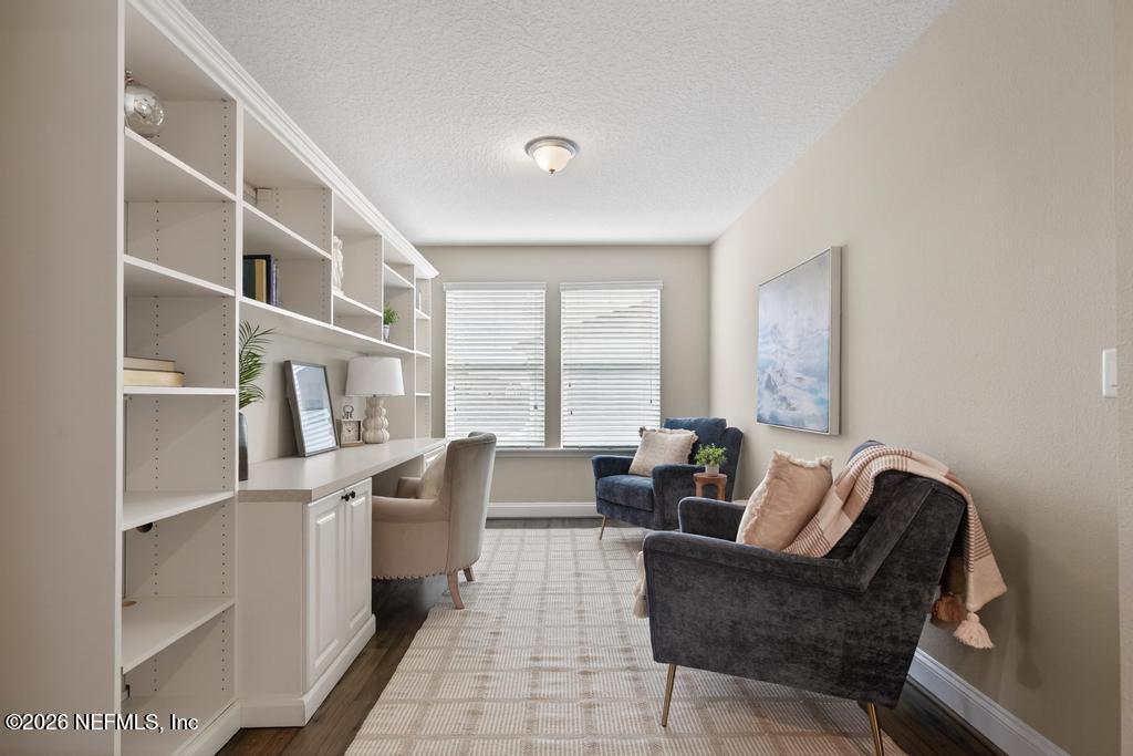 383 Sweet Oak Way St. Augustine, FL 32095 - Photo 31 of 74 a living room with furniture and a large window