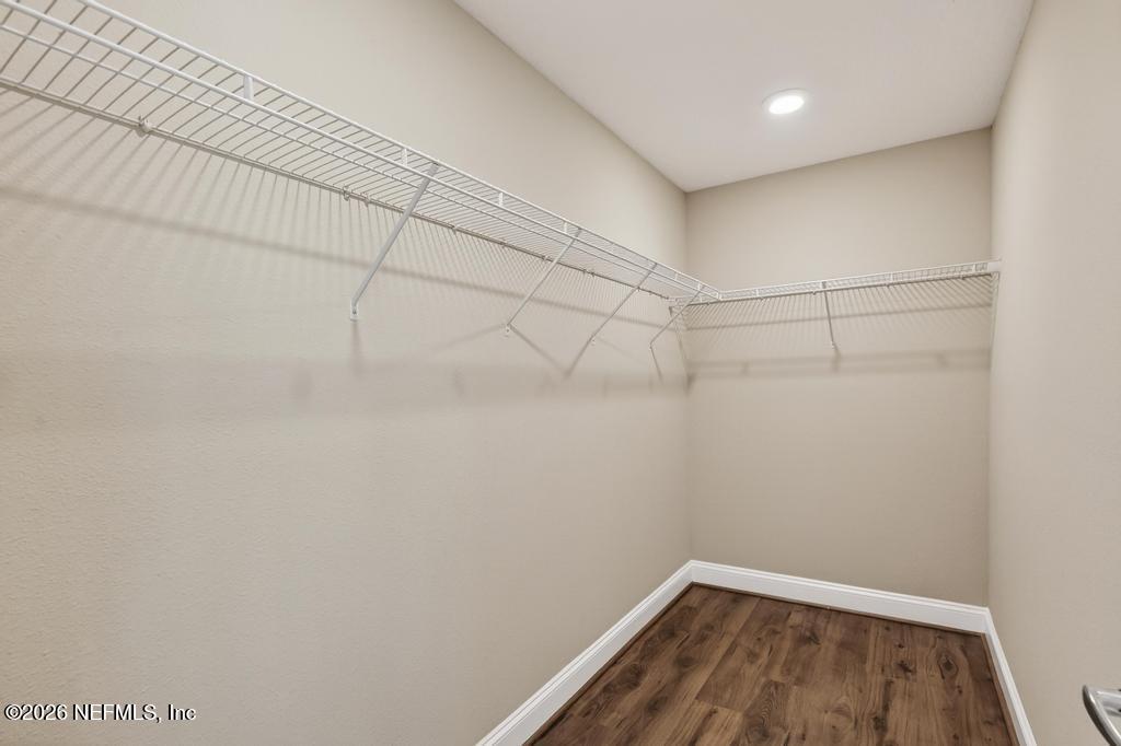 383 Sweet Oak Way St. Augustine, FL 32095 - Photo 44 of 74 a view of a room with racks on the wall