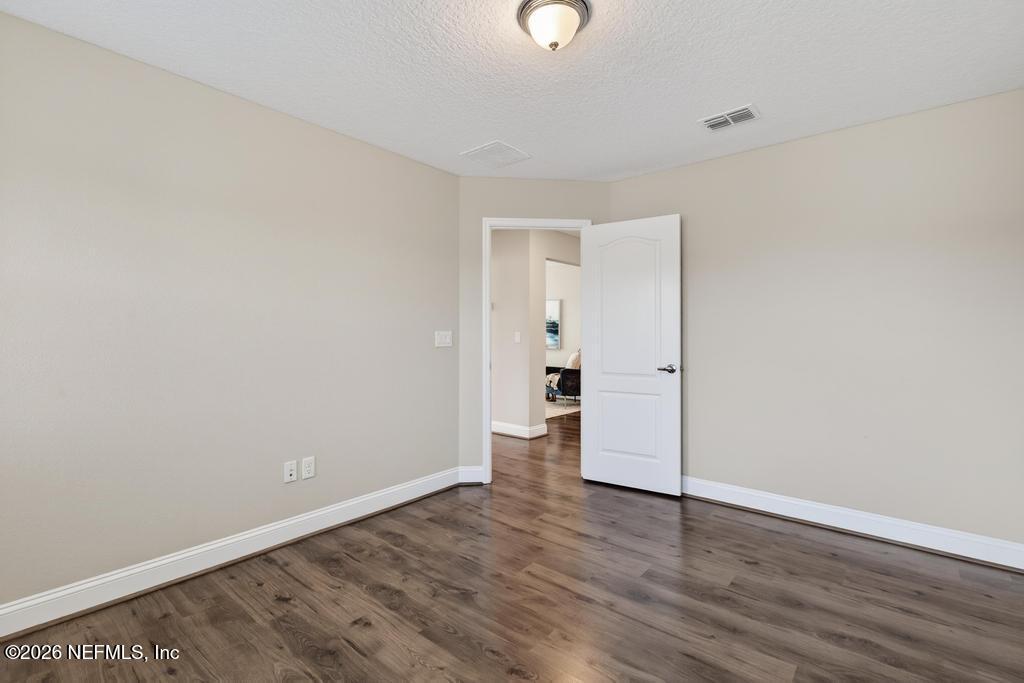 383 Sweet Oak Way St. Augustine, FL 32095 - Photo 47 of 74 wooden floor in an empty room