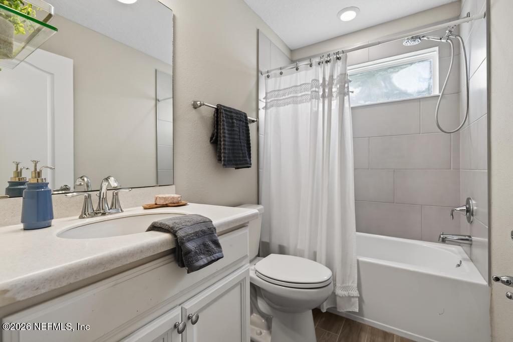 383 Sweet Oak Way St. Augustine, FL 32095 - Photo 48 of 74 a bathroom with a sink a toilet and shower