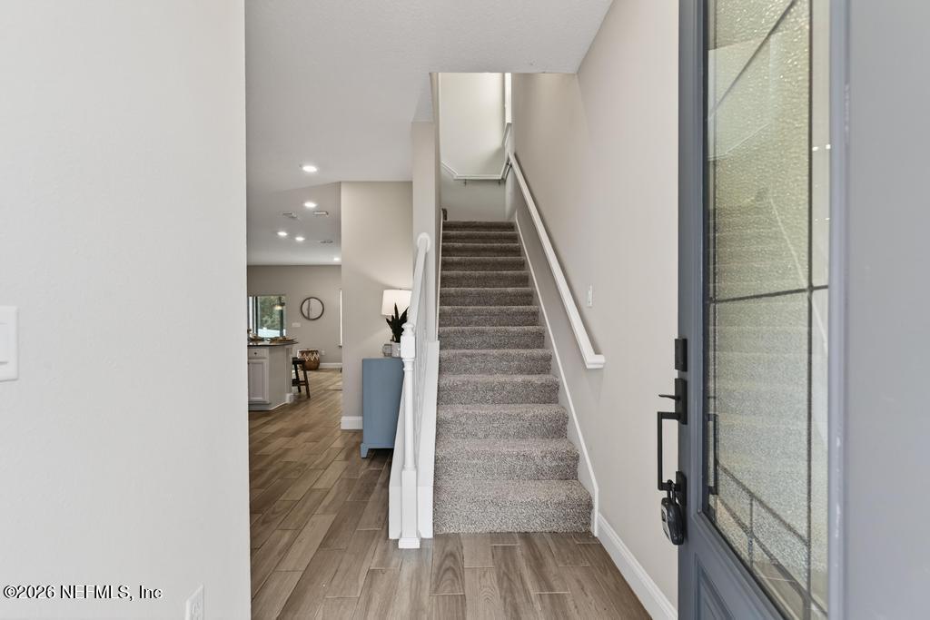 383 Sweet Oak Way St. Augustine, FL 32095 - Photo 6 of 74 a view of entryway and hall with wooden floor