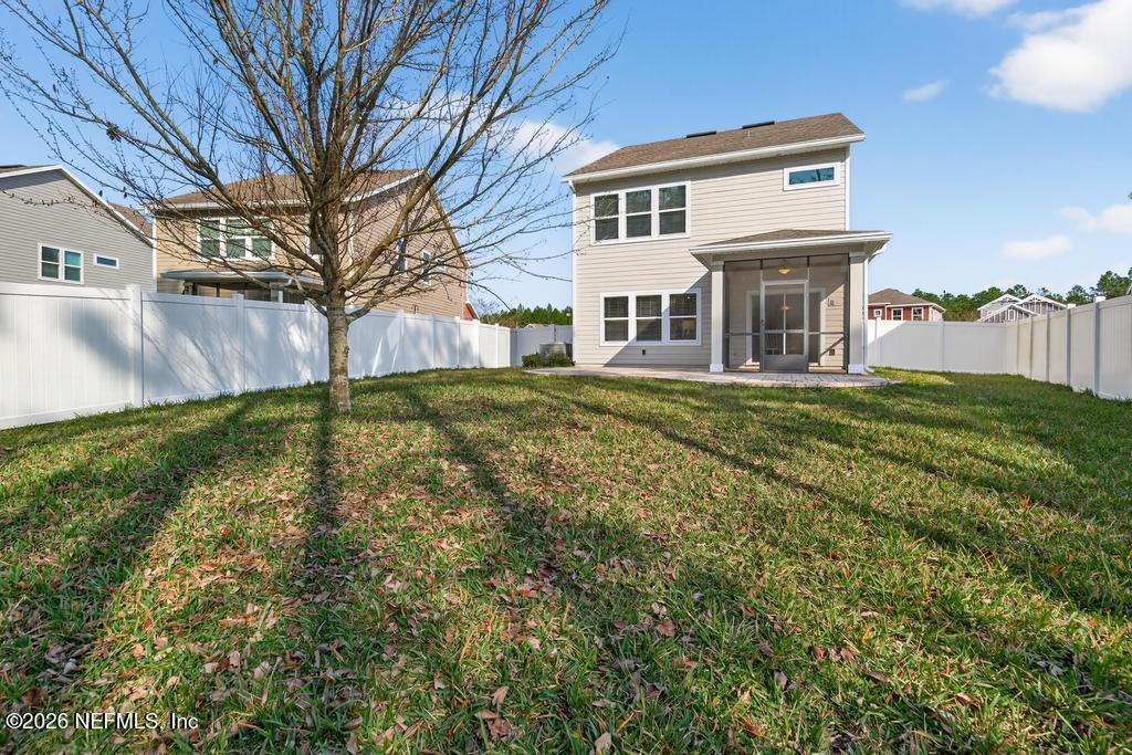 383 Sweet Oak Way St. Augustine, FL 32095 - Photo 70 of 74 a view of a house with a yard