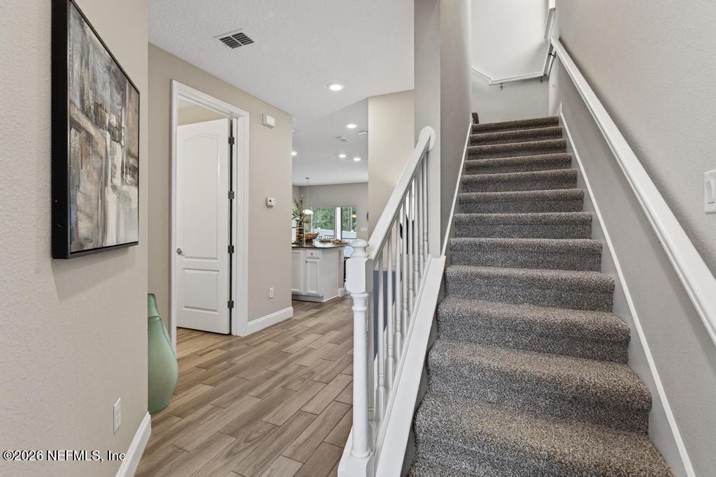 383 Sweet Oak Way St. Augustine, FL 32095 - Photo 8 of 74 a view of an entryway with wooden floor