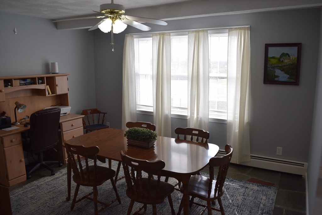 475 Cedar Avenue Swansea, MA 02777 - Photo 13 of 42 a view of a dining room with furniture and window