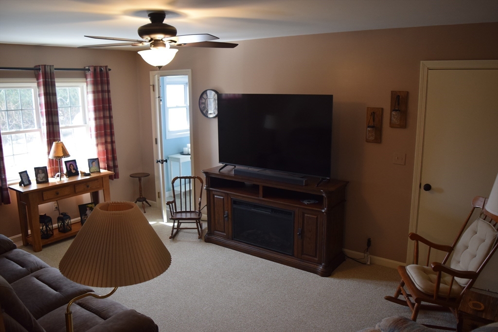 475 Cedar Avenue Swansea, MA 02777 - Photo 14 of 42 a living room with furniture and a flat screen tv