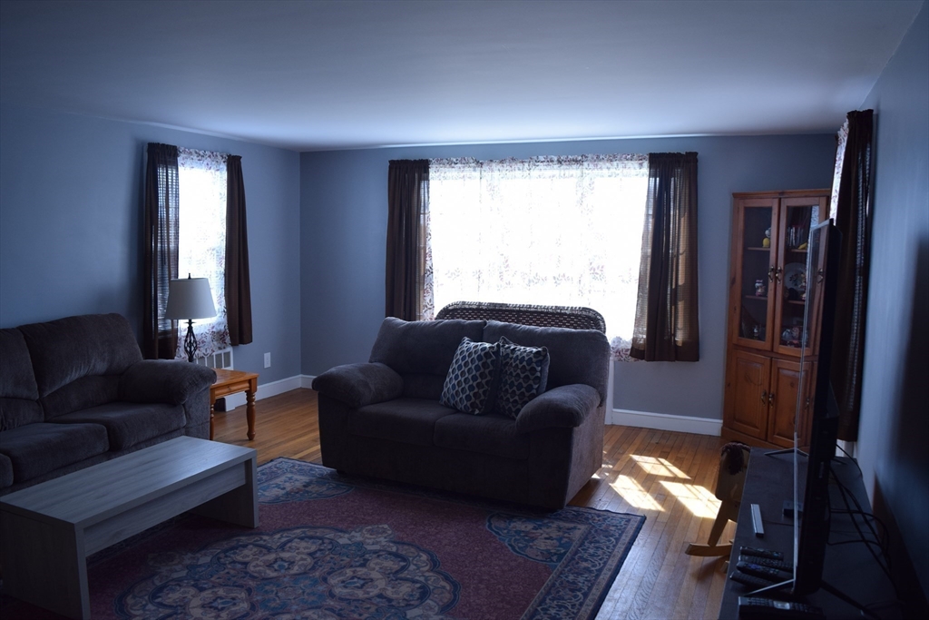475 Cedar Avenue Swansea, MA 02777 - Photo 16 of 42 a living room with furniture and a window