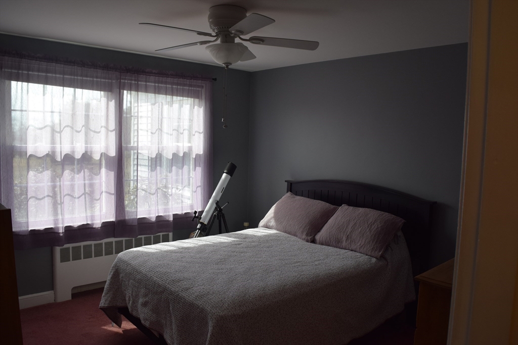 475 Cedar Avenue Swansea, MA 02777 - Photo 20 of 42 a bedroom with a large bed and a large window