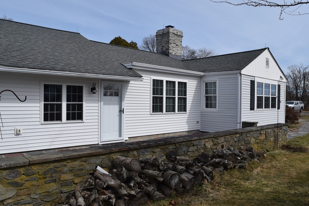 475 Cedar Avenue Swansea, MA 02777 - Photo 3 of 42 a front view of a house with a garden