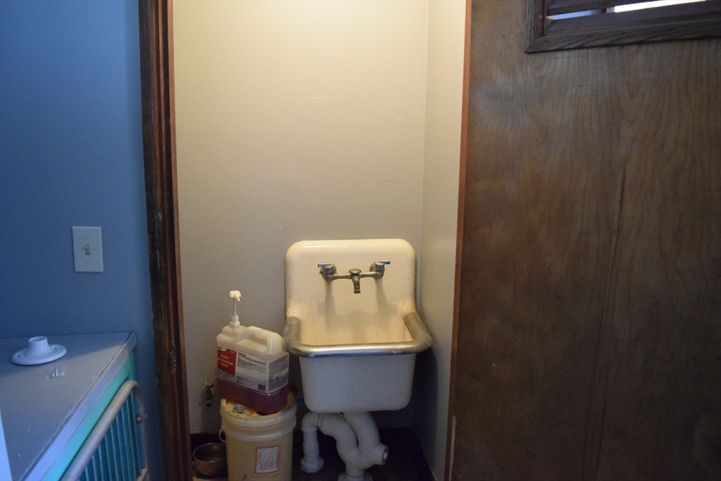 475 Cedar Avenue Swansea, MA 02777 - Photo 34 of 42 a bathroom with a toilet a sink and mirror
