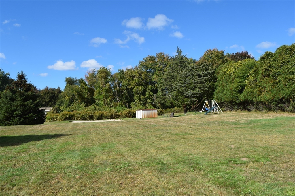 475 Cedar Avenue Swansea, MA 02777 - Photo 8 of 42 a view of big yard with a house