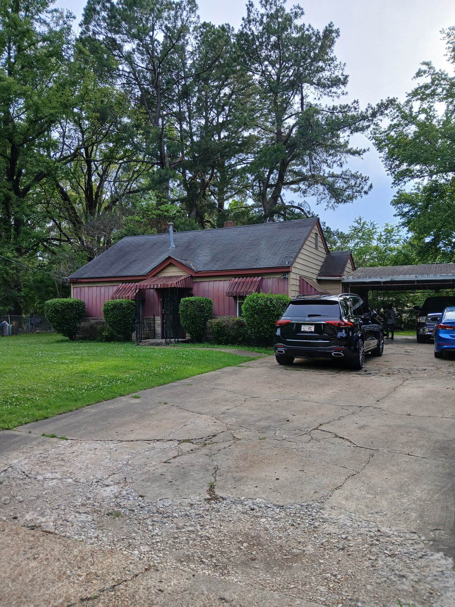 2089 Charjean Road Memphis, TN 38114 - Photo 1 of 1 Ranch-style home featuring a front lawn, driveway, and a carport