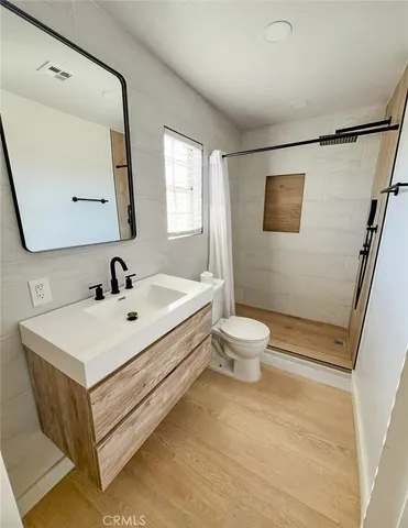 a white bath tub sitting next to a white toilet