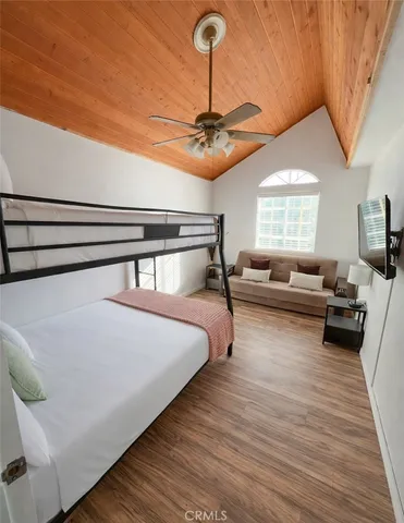 a bedroom with bed and window