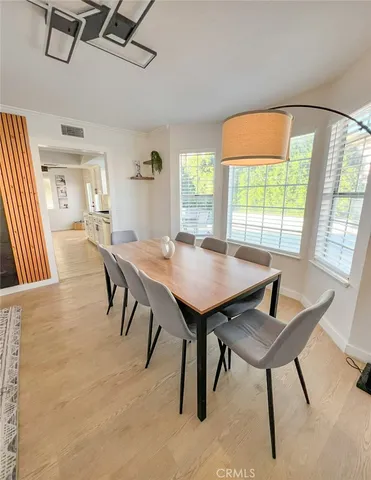 a view of a dining room with furniture and window