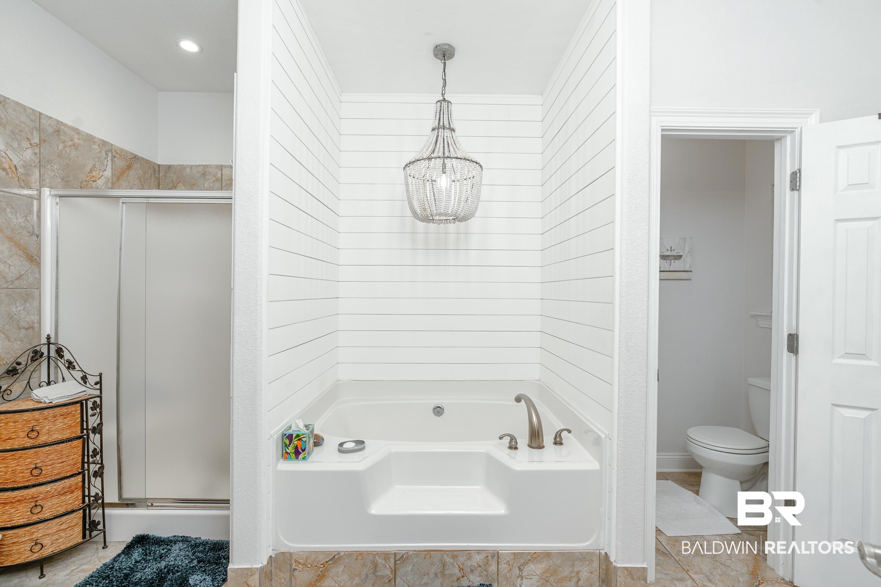 302 Bristol Way Foley, AL 36535 - Photo 18 of 51 Bathroom with tile patterned flooring, plus walk in shower, and toilet