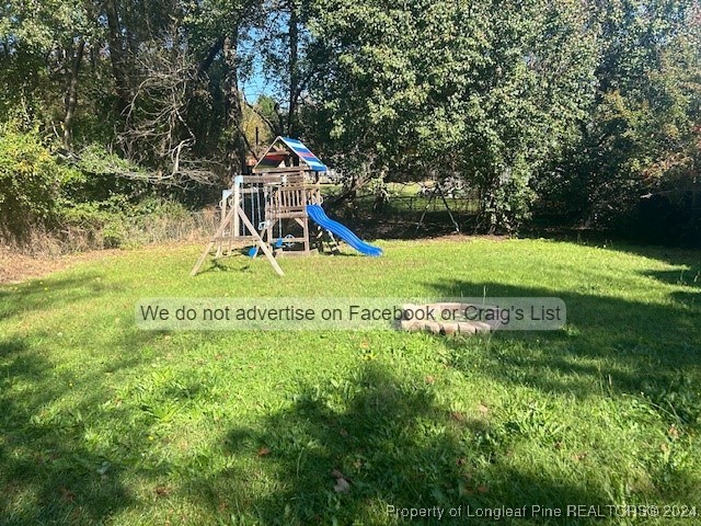 528 Heritage Way Cameron, NC 28326 - Photo 9 of 10 a small garden with trees in the background